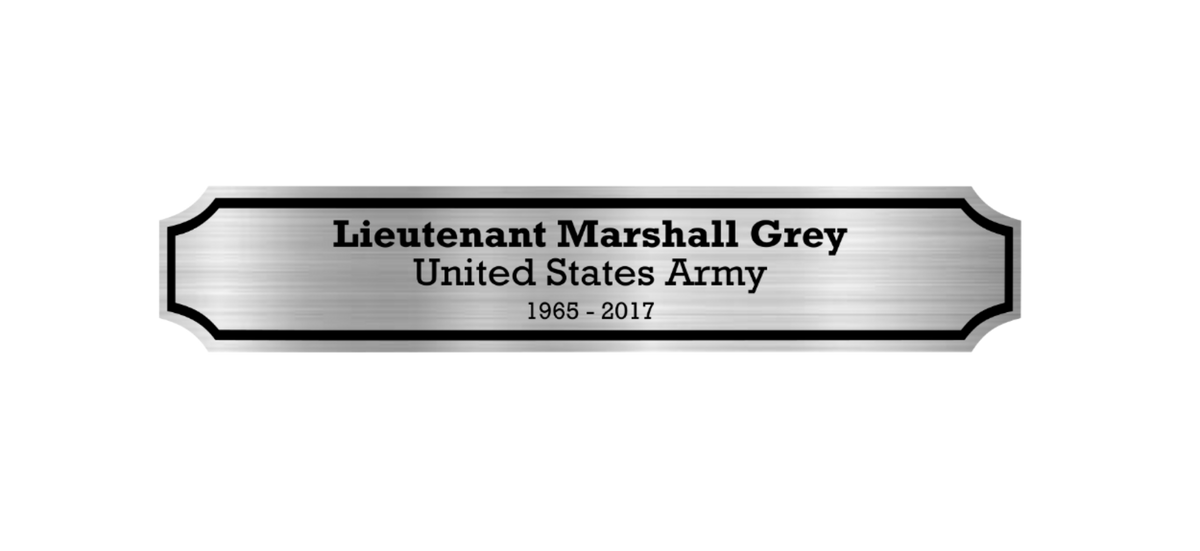 A rectangular brushed-metal memorial plaque for veteran flag cases with rounded decorative corners, featuring the engraved text 'Lieutenant Marshall Grey', 'United States Army', and '1965 - 2017' on a plain white background.